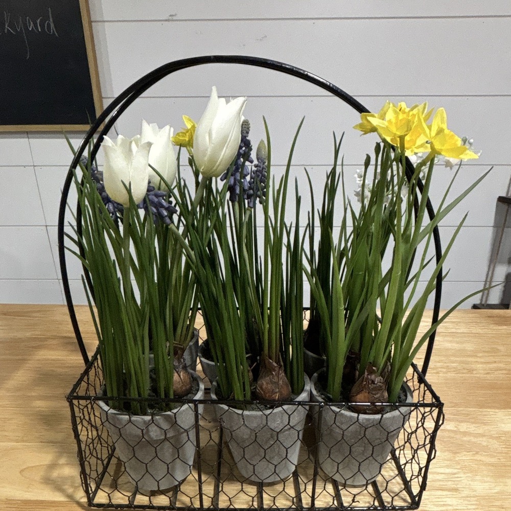 Artificial Bulbed Flowers In Handled Wire Metal Carrying Decorative Bin.